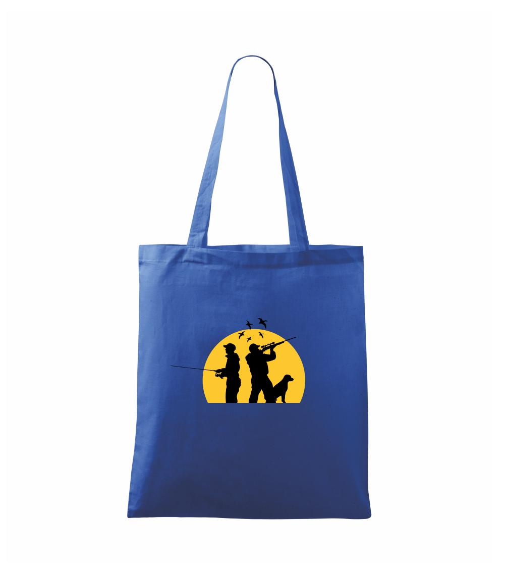 Lovec při západu slunce