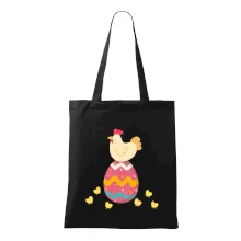 Slepice sedící na velikonočním vejci