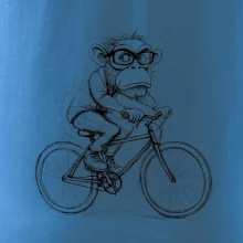 Opice s brýlemi na kole