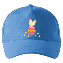 Slepice sedící na velikonočním vejci