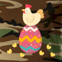 Slepice sedící na velikonočním vejci