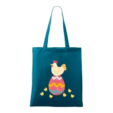 Slepice sedící na velikonočním vejci