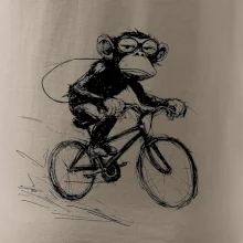 Opice s batohem na kole