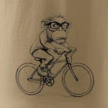 Opice s brýlemi na kole