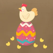 Slepice sedící na velikonočním vejci