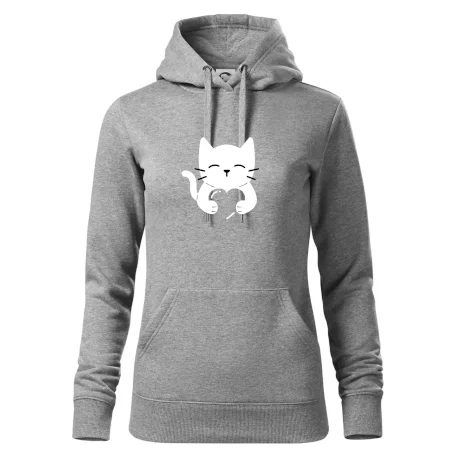 Kočka drží srdce